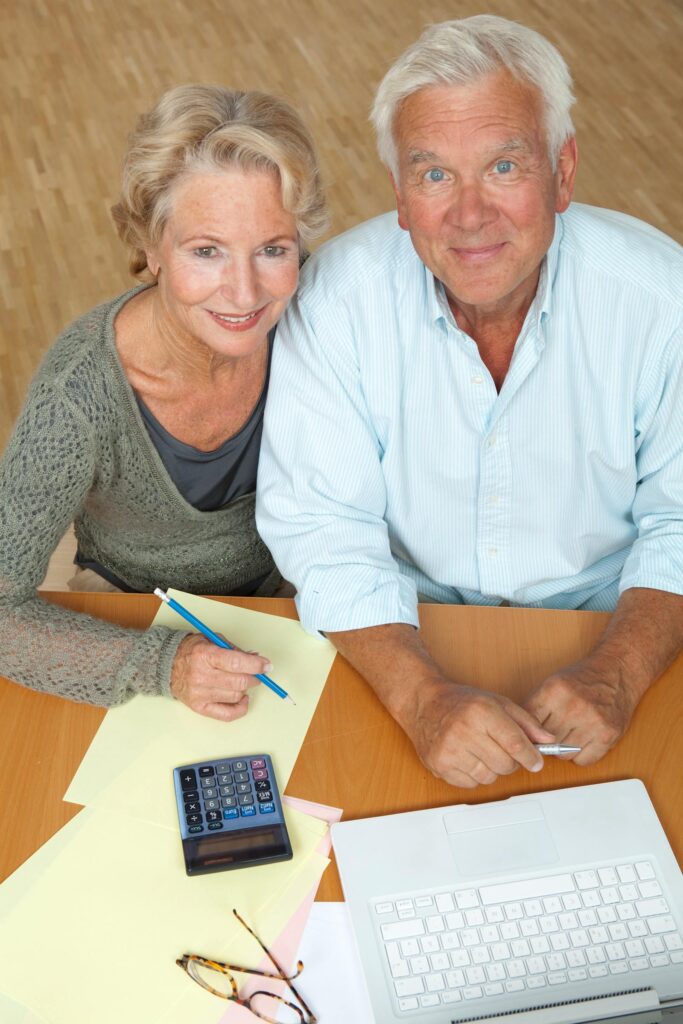 A senior couple reviewing plans together at home.